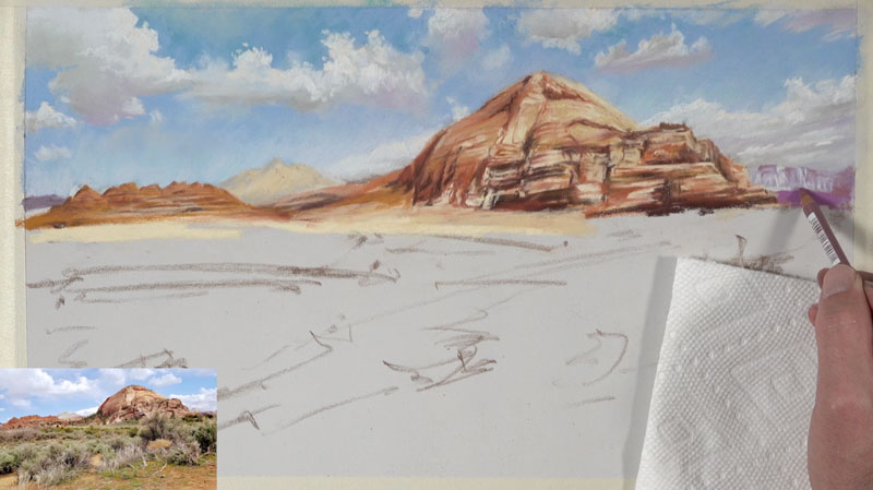 Adding a few details to the distant mountains with pastel pencils