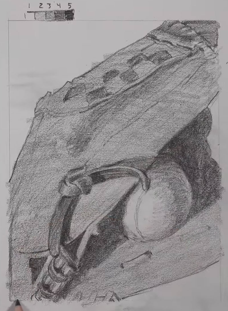 Shading the baseball glove and ball with pencil